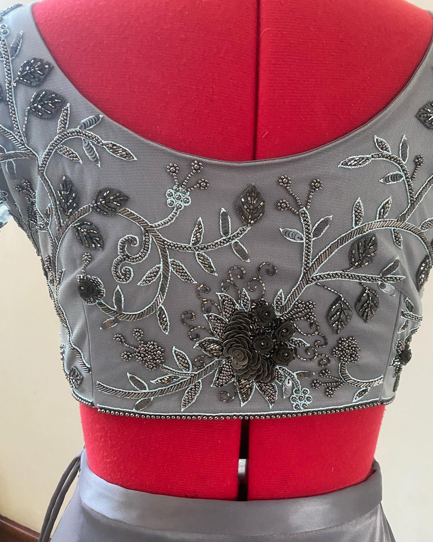 Macro shot of fine hem finishing, zip repairs, and delicate garment adjustments